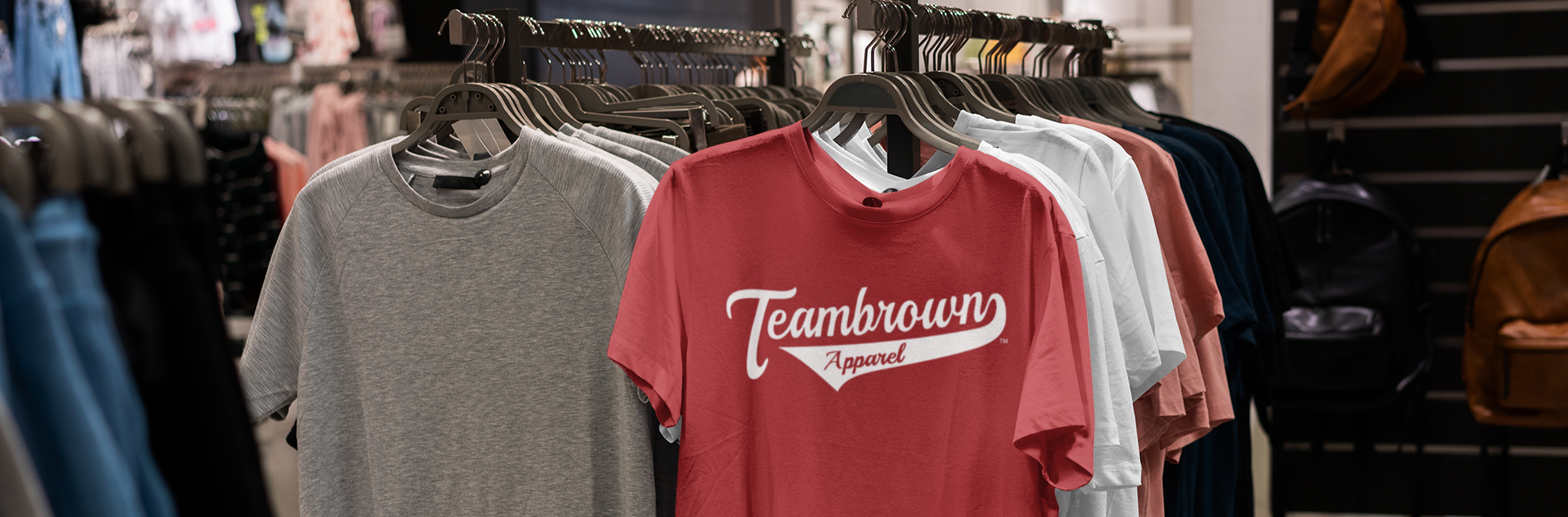 custom shirts baseball gear and apparel made to order in small minimums shirts hung on a rack of clothing