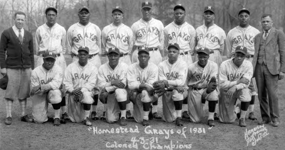 Historic black-and-white team photo of the Homestead Grays, a Negro League baseball team, featuring players in uniform with 'Grays' across their jerseys, taken in 1931.